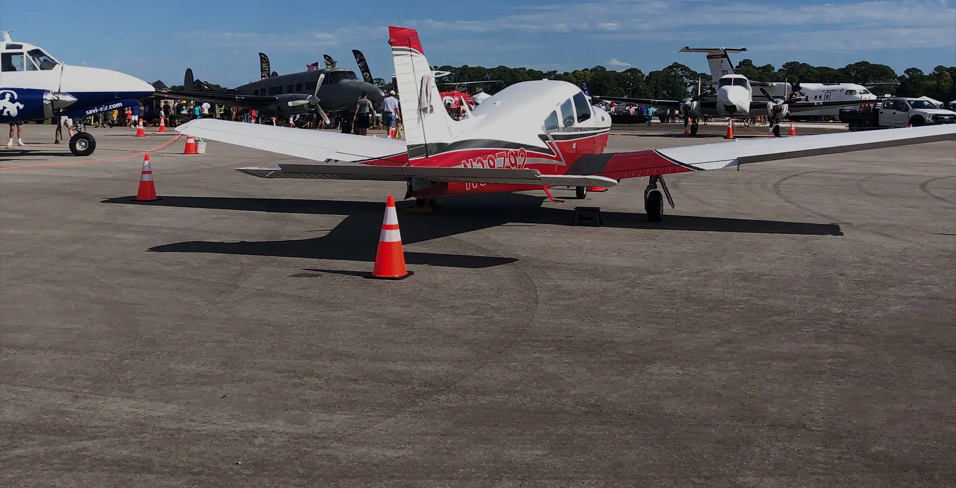 A red colored plane on tarmac