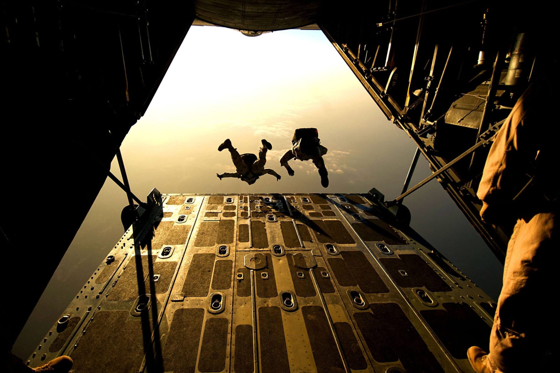 A couple of people jumping from plane