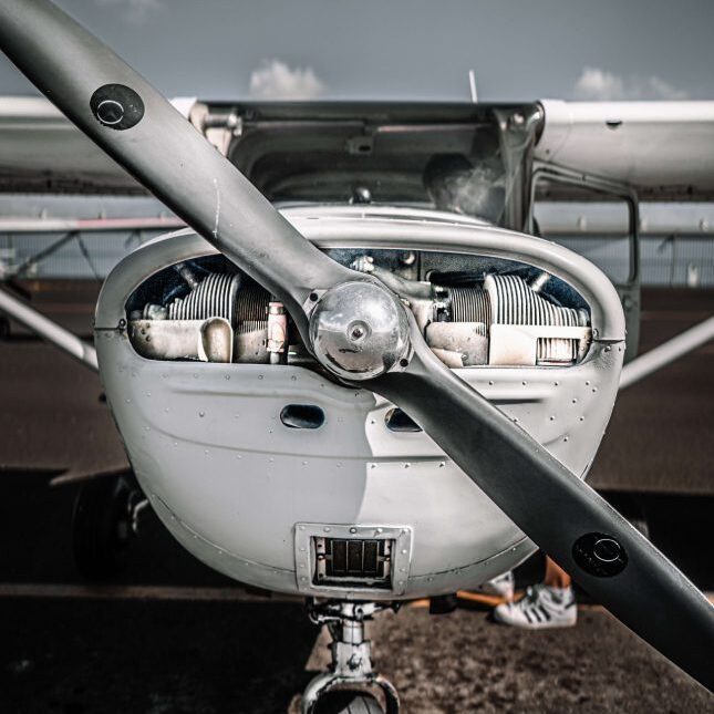 A white colored chopper with wheels