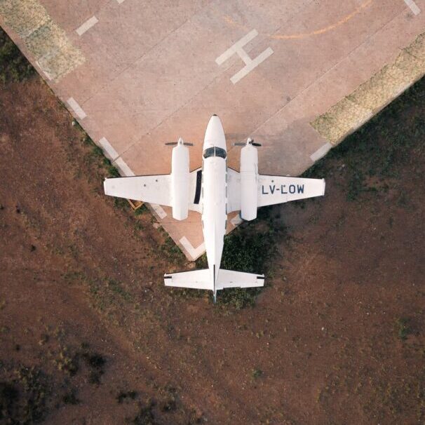 A white colored plane landed on the tarmac